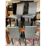 A set of six modern upholstered dining chairs.