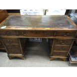 A Yew wood pedestal desk fitted with drawers. With
