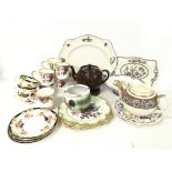 A collection of assorted tea set cups, plates, tea