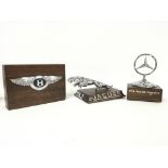 A collection of bonnet ornaments including Bentley