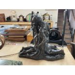 Cold cast resin figure depicting a male & female b