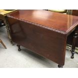 A Victorian mahogany drop leaf dining table and a