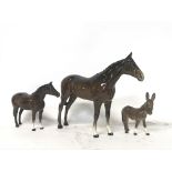 Two Beswick horses and a donkey