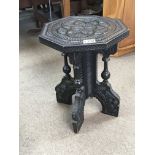 A Victorian carved hardwood occasional table with
