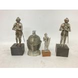 Small knights in armour figures with a table light