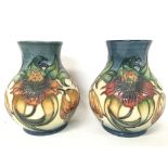 Moorcroft vases, approximate heights 16cm.