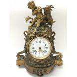 Gilt ormolu clock featuring a Putto and goat. Approximately 32x14x23cm