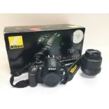 A boxed Nikon D3100 camera with Nikon lens and acc