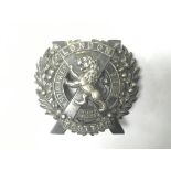 WW1 British London Scottish Regiment Silver Cap Badge. The badge depicting a Lion in a St. Andrews