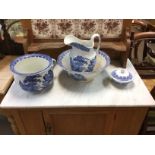 A blue and white wash bowl and jug along with a ch