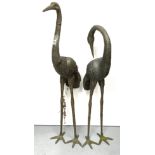 A pair of cast bronze stork figures, 103cm.