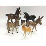 Five Beswick animal figures comprising a horse and