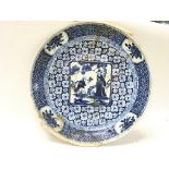 Chinese export large Blue and white plate with floral decoration and a depiction of two Chinese