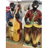 A pair of pottery figures in the form of musicams