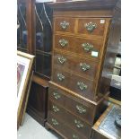 A burr walnut and cross banded chest on chest fitt