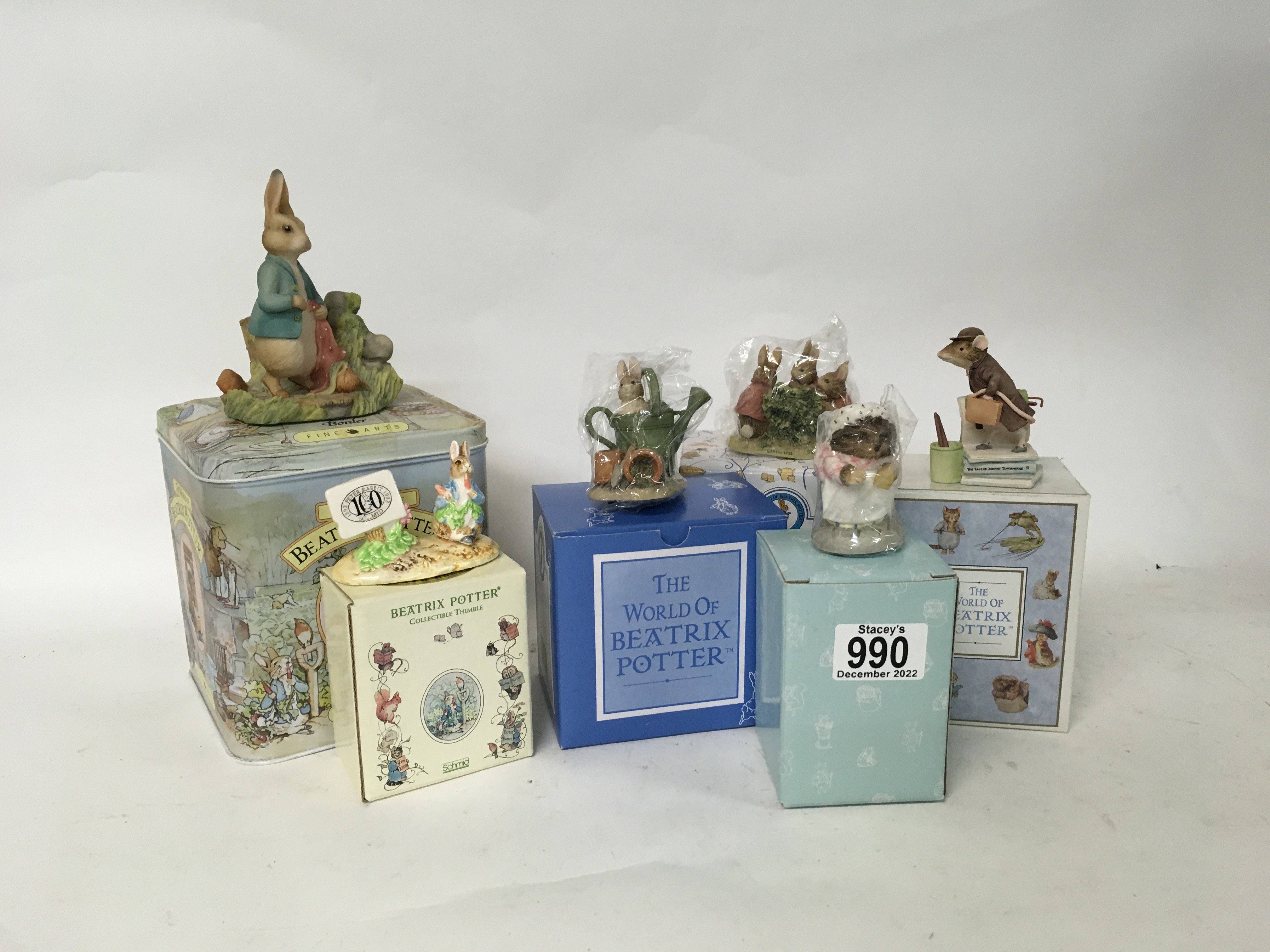 A box containing a collection of Beatrix Potter fi