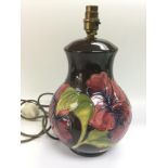 A Moorcroft lamp of baluster from in hibiscus patt