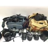 A collection of cameras and lenses comprising main