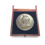 A cased Queen Victoria bronze medallion.
