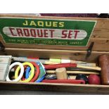 A Jaques croquet set fitted in a pine box .