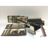 A stereoscope viewer and cards depicting the Briti