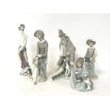 A collection of porcelain figures including Lladro