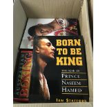 A box containing boxing books including autobiogra