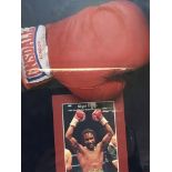 A signed boxing glove in a presentation case Nigel