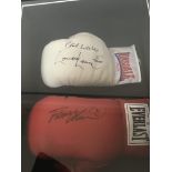 A case containing two signed boxing gloves Lennox