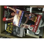 A box containing boxing books including biographys