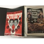 An album containing boxing programs from 1988-2001