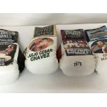 Four boxing gloves decorated with boxers and fight