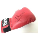 A framed boxing Glove signed by Nathan Cleverly.