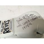 A boxing glove signed by John H Strachey.