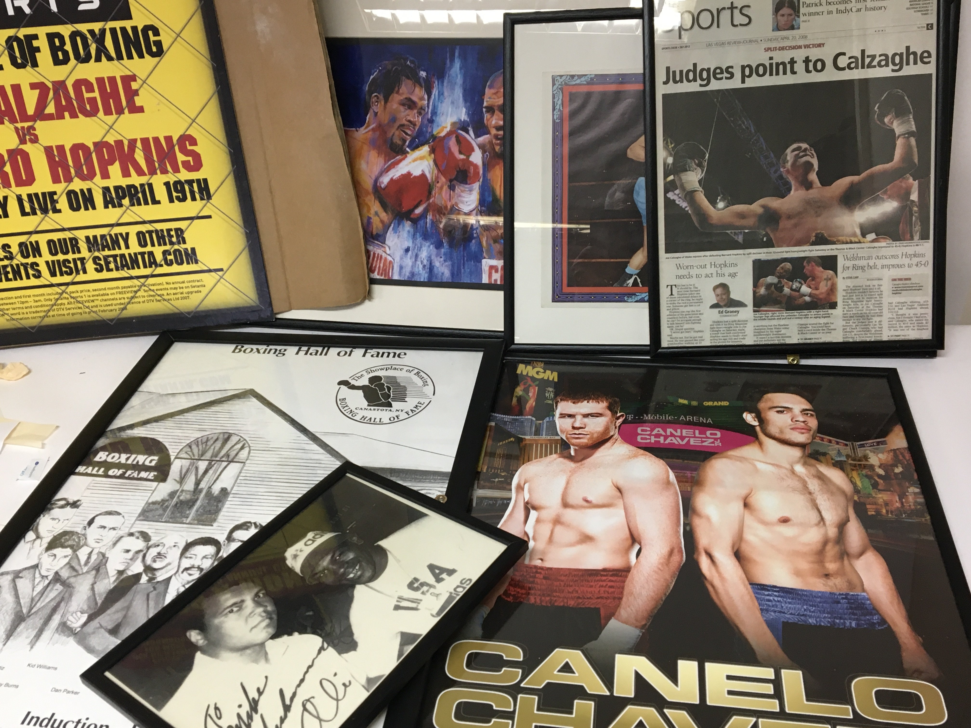 A collection of framed boxing memorabilia and a Se