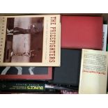 A box containing boxing books and a box containing British Boxing Year books. (2)