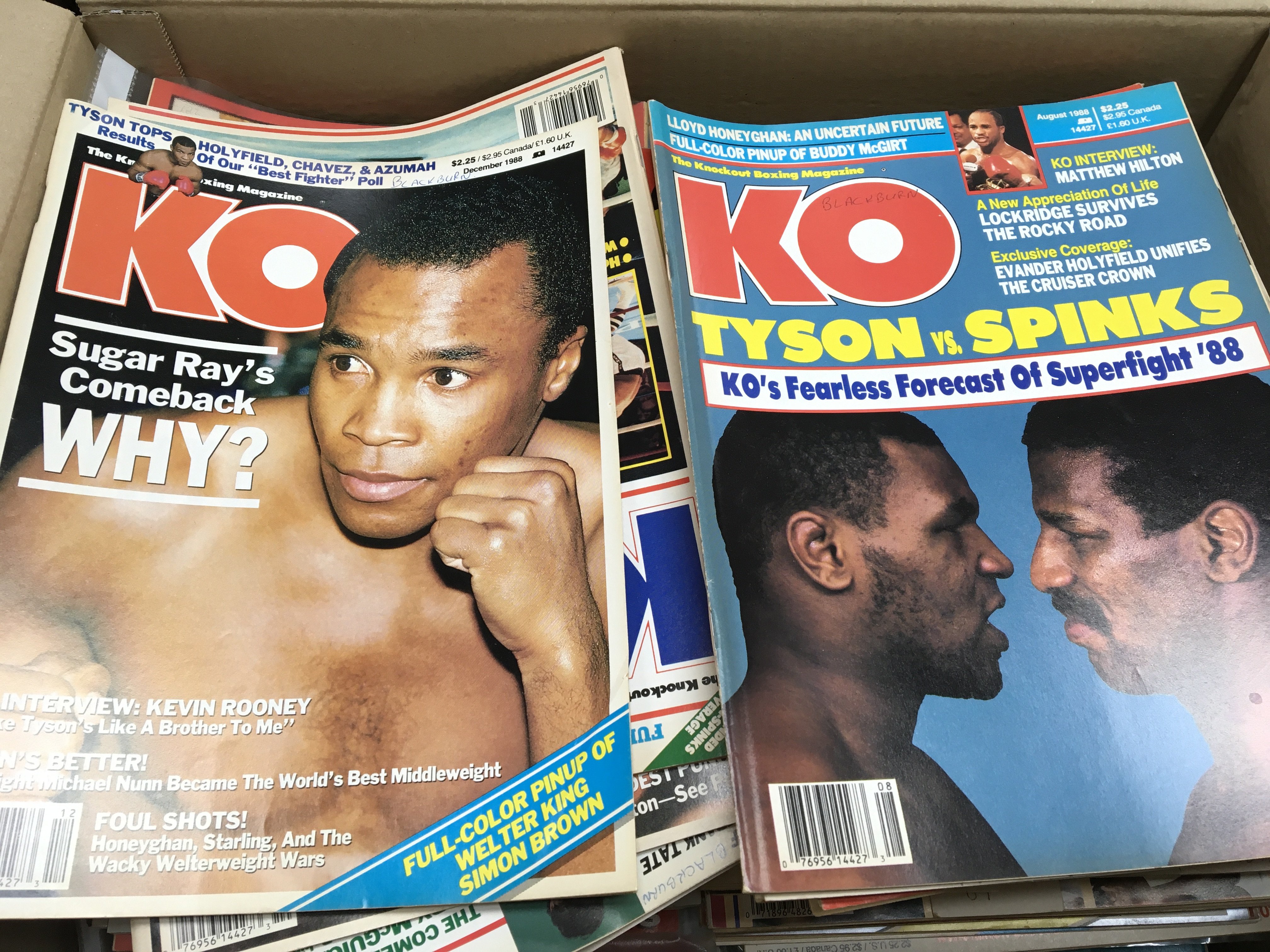 A collection of KO boxing magazines from 1972-1987 and a box of boxing calendars.