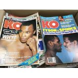 A collection of KO boxing magazines from 1972-1987 and a box of boxing calendars.