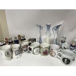 A collection of royal commemorative mugs , three D