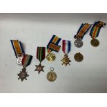 A collection of WWI medals, one awarded to 17553 p