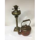A brass Corinthian column oil lamp and a copper ke