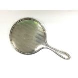 A silver backed hand mirror, Birmingham hallmarks.