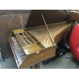 A walnut baby grand cased Harpsichord maker John M