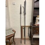 Two wooden and metal spears, one a 19th Century copy of a Halberd and the other an African tribal sp