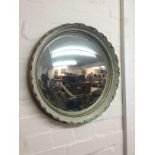 A circular framed convex mirror, approx diameter 4