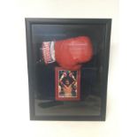 A signed by Nigel Benn cased boxing glove