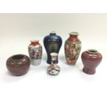 Six small Oriental vases, various shapes and desig