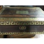 A Victorian rosewood and brass bound writing slope