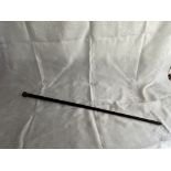 An Ebony walking stick with silver top