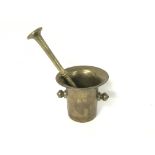 A 18th century brass mortar and pestle.